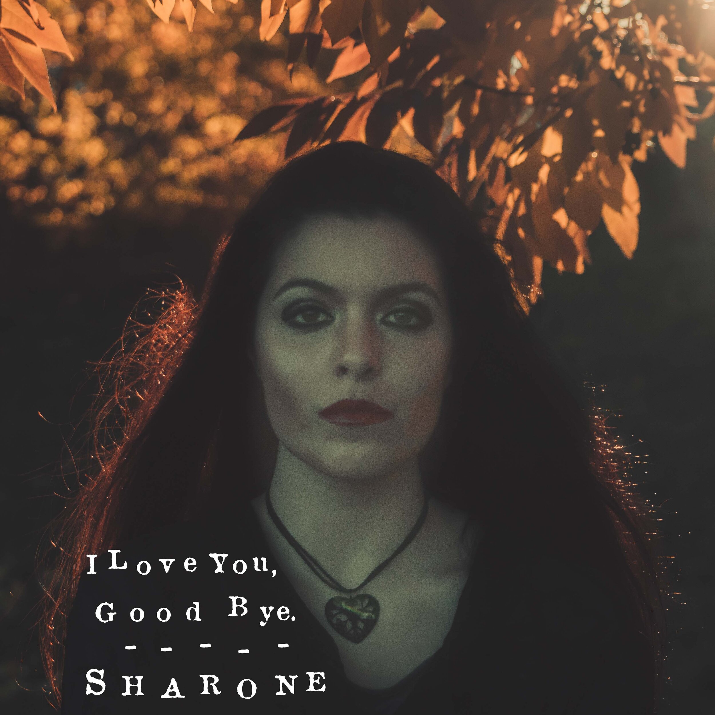 The single cover made for Sharone. A portrait in front of autumn leaves with the record title set across the foot of the frame.