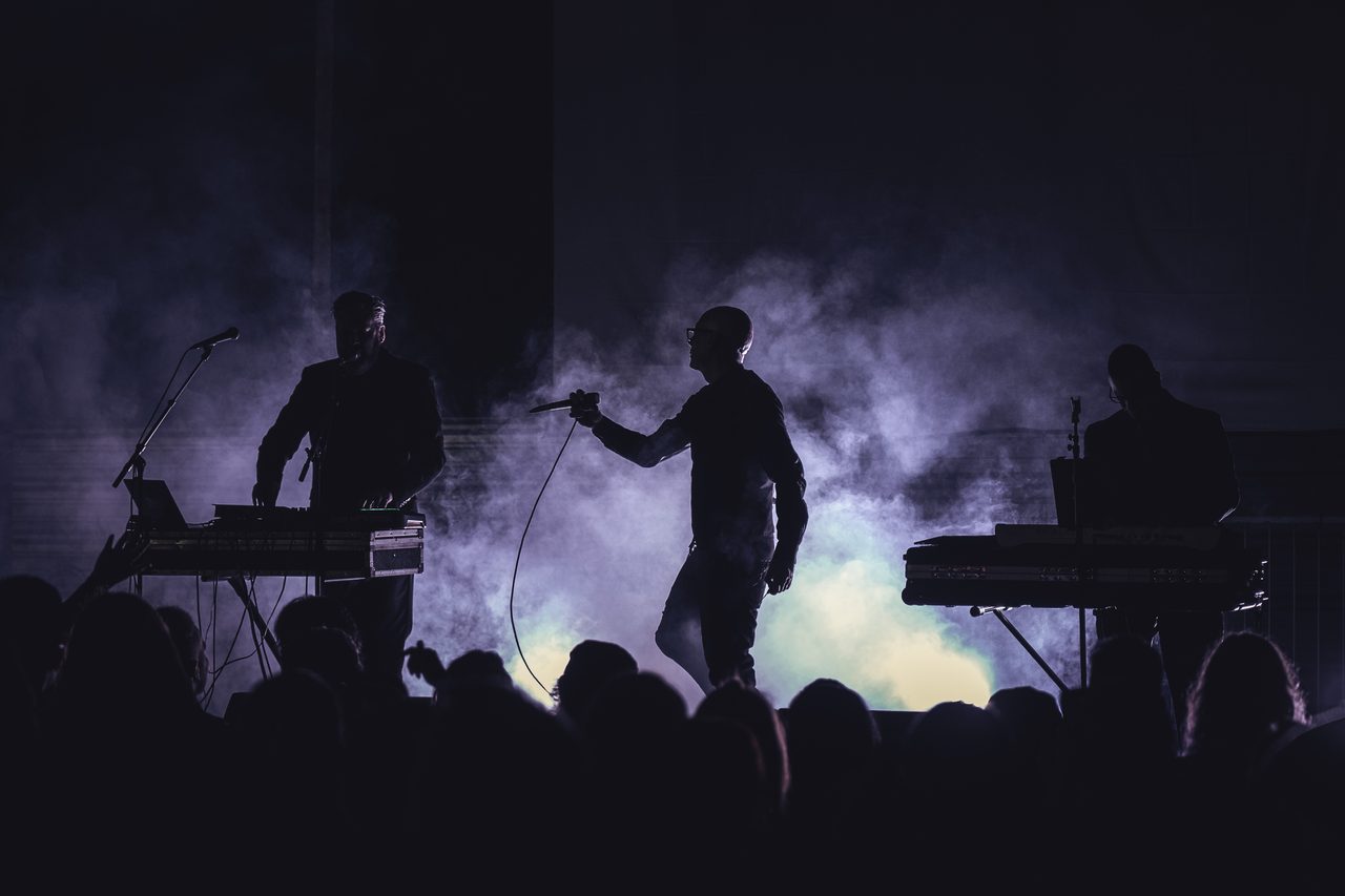 Covenant performing live.