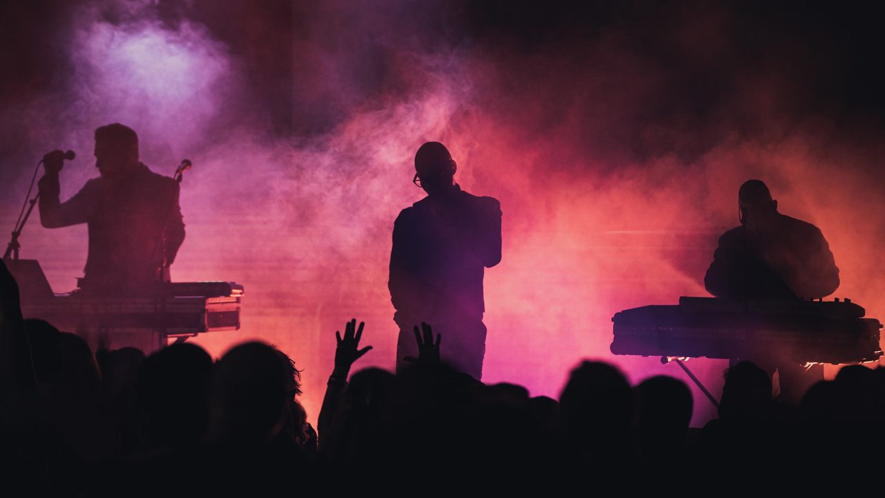 Covenant performing live.