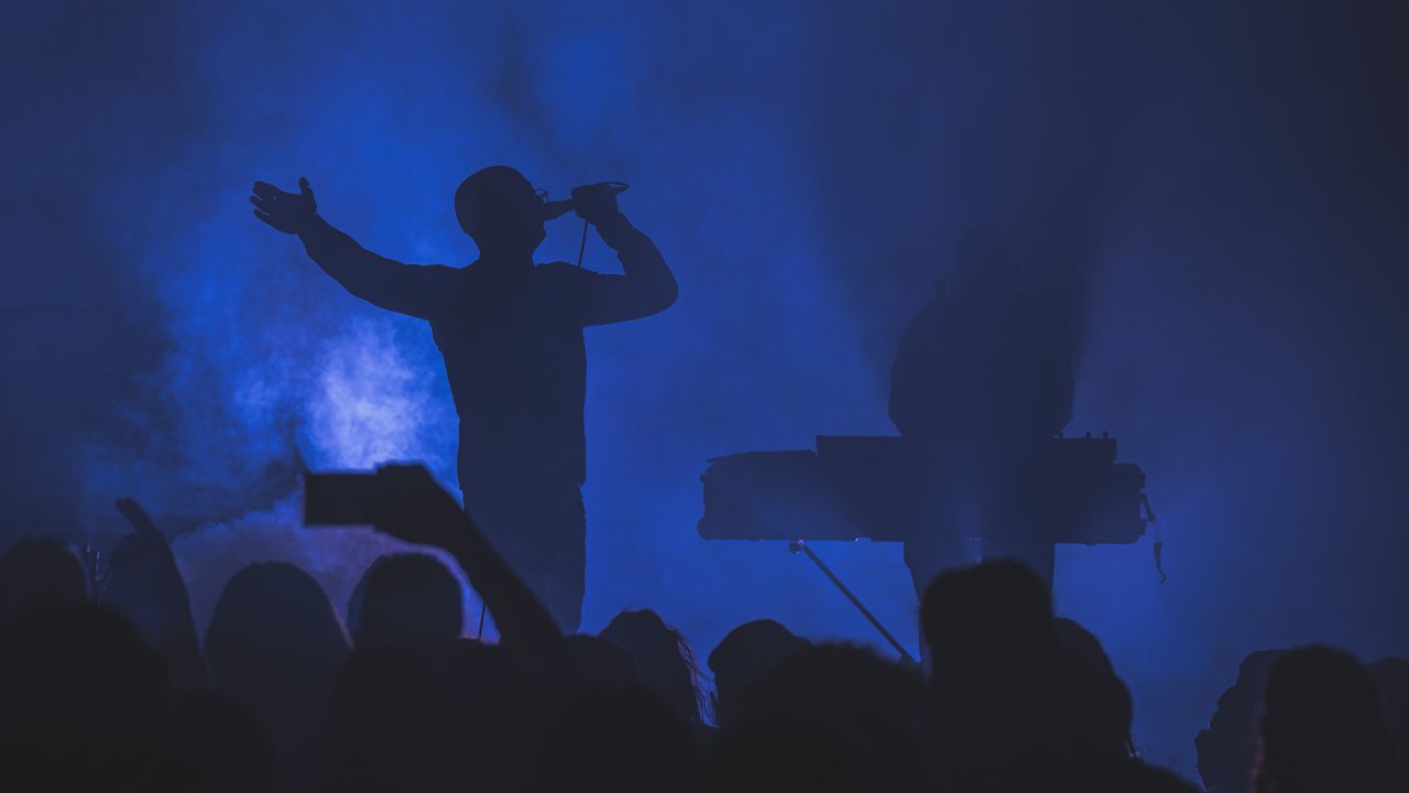 Covenant performing live.