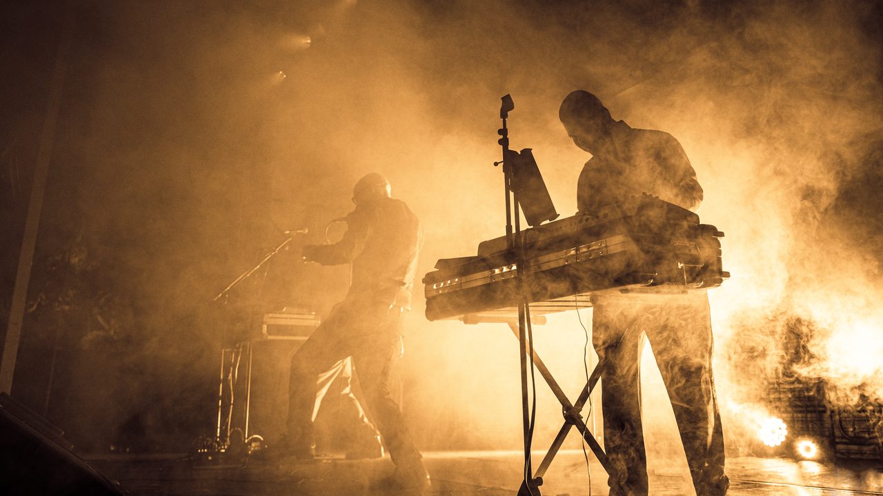Covenant performing live.